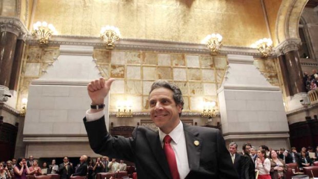 New York Governor Andrew Cuomo gives the thumbs up after same-sex marriage was legalised in the state.