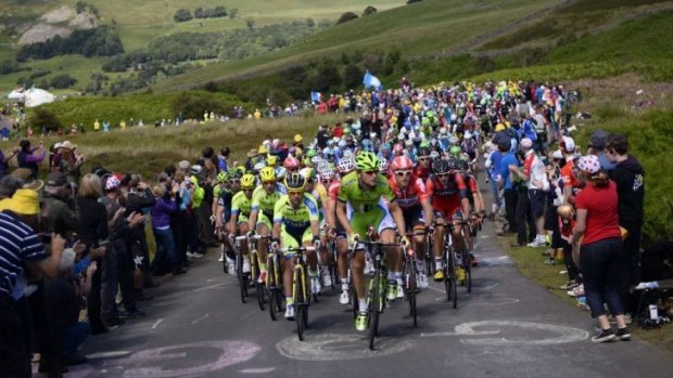 Big crowds: Many fans flocked to see the opening day of the Tour de France from Leeds to Harrogate in northern England.