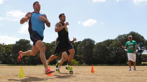 No letting up: Shaun Kenny-Dowall and Mitchell Pearce work out with Roger Fabri.