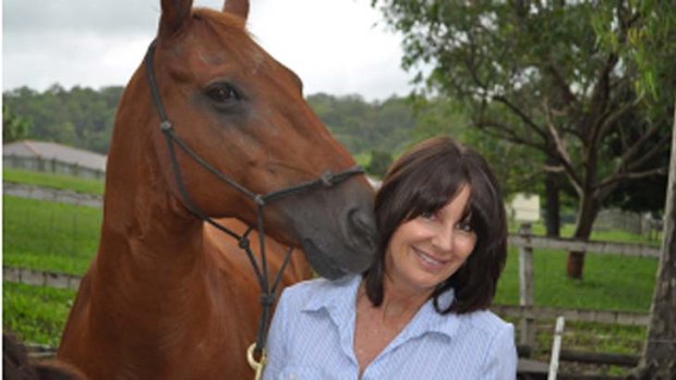 No words needed: Sue Spence with one of her horses.