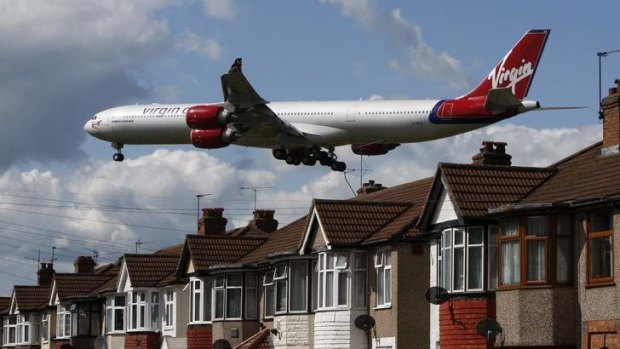 A plane comes in to land at Heathrow Airport in London.