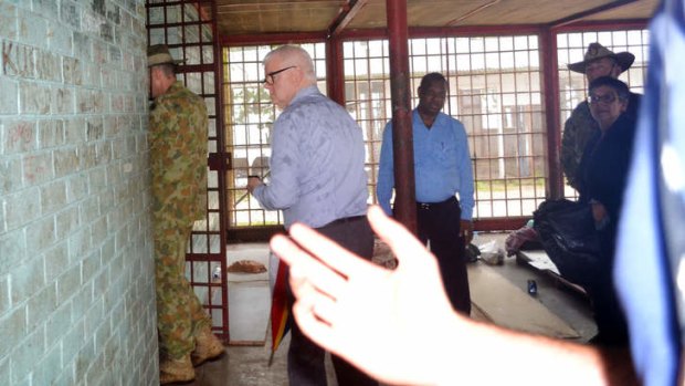 Immigration Department official tries to block Fairfax photographing Lieutenant General Angus Campbell as he visits the squalid Manus Island Police station prison where six asylum seekers were locked up for 48 hours.