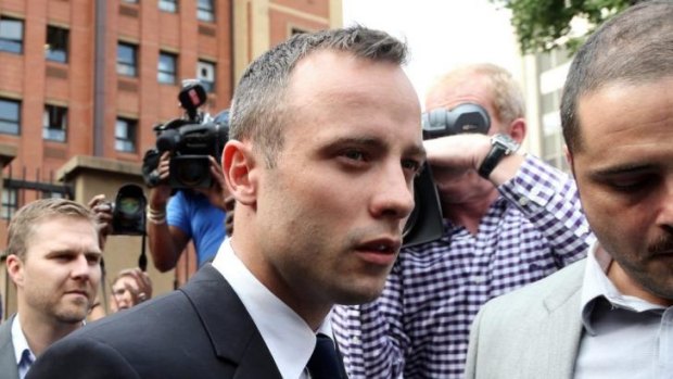 Oscar Pistorius leaves the high court in Pretoria after the prosecution finished its cross examination of the athlete.