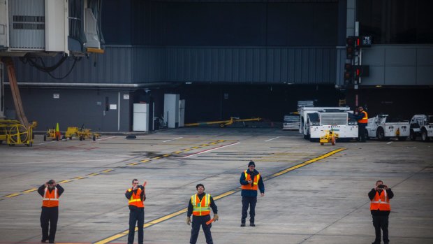 Members of the ground crew record the final 747 flight by any commercial United States airline at Hartsfield-Jackson International Airport in Atlanta on January 3, 2018.  