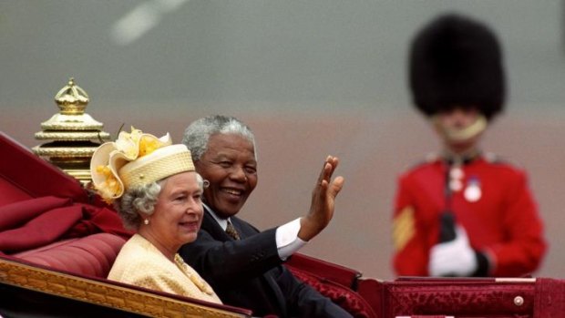 Nelson Mandela with Britain's Queen Elizabeth II riding in a carriage along the Mall, London, on the first full day of his state visit to Britain.