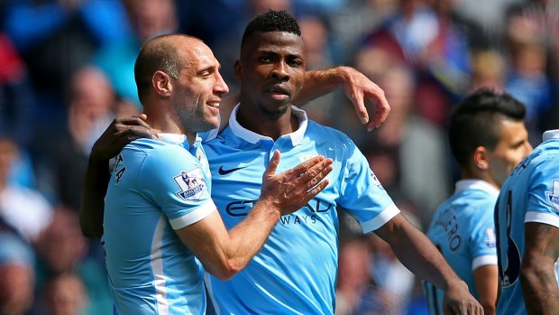 MANCHESTER, ENGLAND - APRIL 23:  Kelechi Iheanacho of Manchester City celebrates with Pablo Zabaleta of Manchester City after scoring his sides third goal during the Barclays Premier League match between Manchester City and Stoke City at Etihad Stadium on April 23, 2016 in Manchester, United Kingdom.  (Photo by Alex Livesey/Getty Images)