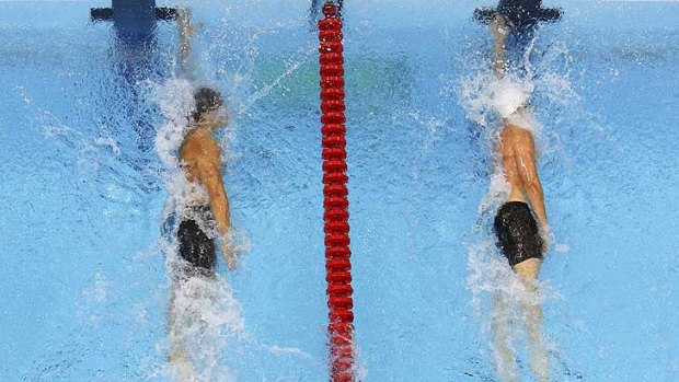 Nothing in it ... Nathan Adrian, left,  touches one hundreth of a second ahead of James Magnussen.