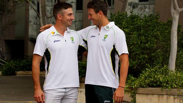Good to be back: Shaun Marsh and James Pattinson congratulate one another after recalls for the South Africa tour.