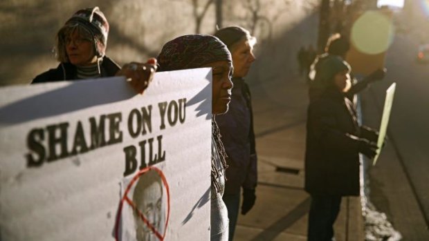 Protesters outside the Bill Cosby show at the Buell Theatre in Denver on Saturday.