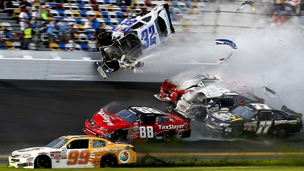 Carnage &#8230; Kyle Larson's Chevrolet ploughed into the fence, injuring spectators.