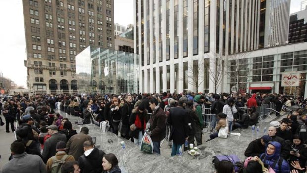 Brand appeal ... hundreds queued outside the Apple store in New York to buy the latest iPad 2.