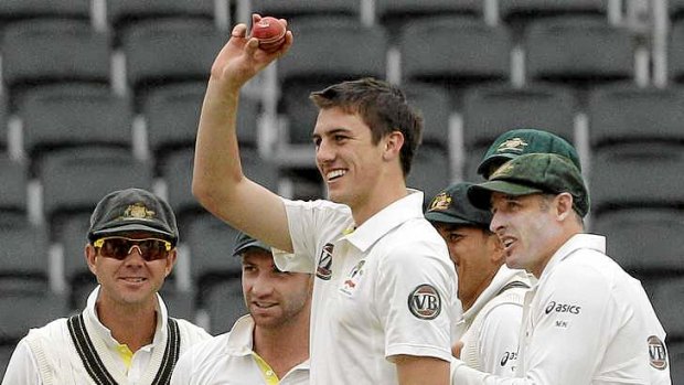 False start: Pat Cummins celebrates taking five wickets on debut in South Africa in his one and only Test before injury.