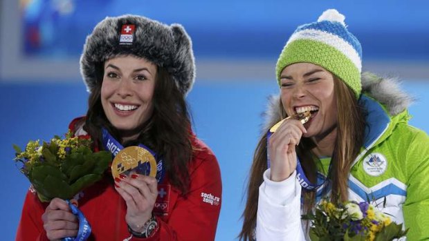 Shared experience: Joint gold medalists Switzerland's Dominique Gisin and Slovenia's Tina Maze after the medal ceremony.