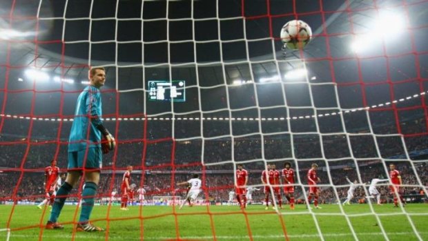 Manuel Neuer of Bayern Muenchen looks on as Cristiano Ronaldo of Real Madrid scores their fourth goal.