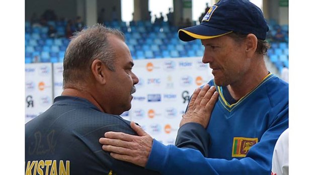 Pakistan coach Dav Whatmore congratulates Sri Lankan coach Graham Ford after the second Test ended on Sunday.