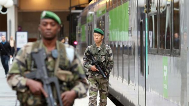 On alert ... soldiers patrol at the Gare du Nord in Paris following warnings of possible terrorist attacks in Europe.