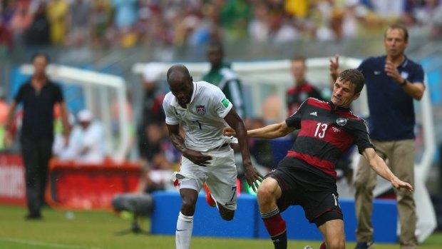 Survived the 'Group of Death' ... the US's DaMarcus Beasley battles past Germany's Thomas Mueller during their 1-0 defeat.