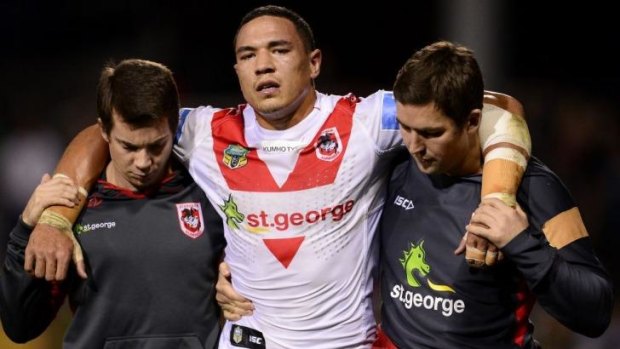 Dragons forward Tyson Frizell is assisted from the field.