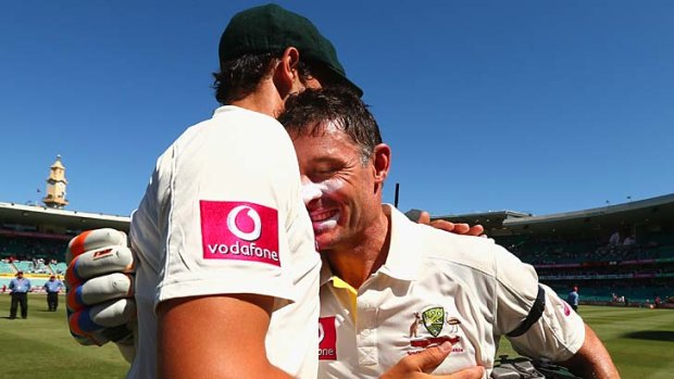 Michael Hussey of Australia is congratulated by Mitchell Starc of Australia after his last last Test match.