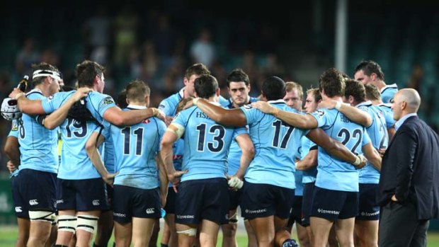 The Waratahs have a team talk after their 25-21 victory over the Sharks last year.