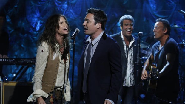 Coming together ... Steven Tyler sings with comedian Jimmy Fallon.