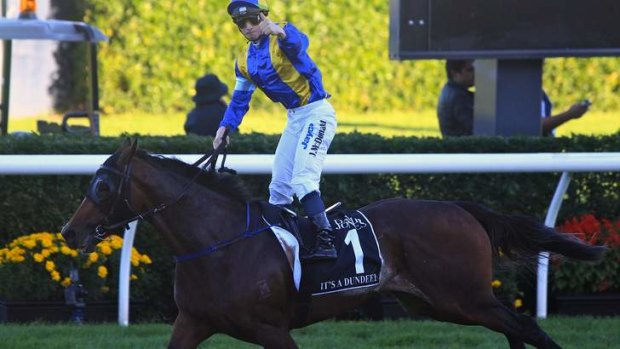 Romper stomper: James McDonald salutes on It's A Dundeel in the Australian Derby at Randwick in April.