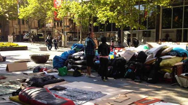 One protester asleep at the Martin Place camp this morning.