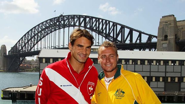 Top shots: Roger Federer (left) and Lleyton Hewitt meet at yesterday's draw for their Davis Cup tie starting in Sydney today.