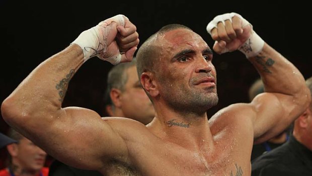 Anthony Mundine muscles up.