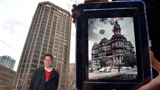 The National Trust's Trent Vittorio and his app picture of the Federal Hotel, which fell to the wreckers' hammer in 1972, to be replaced by the present bank building.