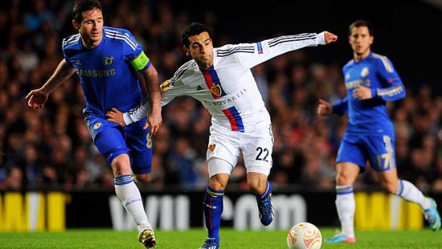 Mohamed Salah of Basel (centre) holds off Frank Lampard of Chelsea during their UEFA Europa League semi final in London.