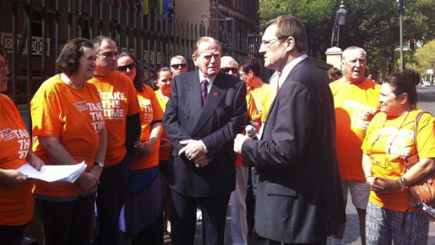 Christian Democratic Party MLC Fred Nile and Gerard Dwyer of the Shop Distributive and Allied Employees Association at a rally outside the NSW Parliament on Wednesday.