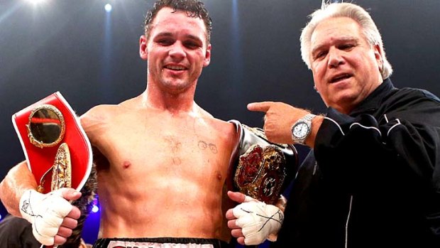 Daniel Geale with his WBA and IBF middleweight world championship belts after defeating Felix Sturm in Germany.