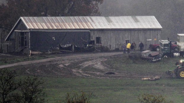 An animal carcass is dragged for burial at the Muskingum County Animal Farm.