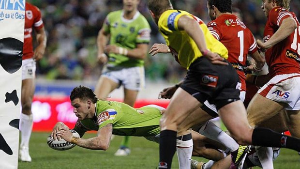 Bad memories: Josh Dugan goes over to score against the Dragons in 2011.