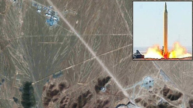 ’’Muscle flex’’ ... the long-range missile launch yesterday, inset; the site of the  nuclear facility near Qom.