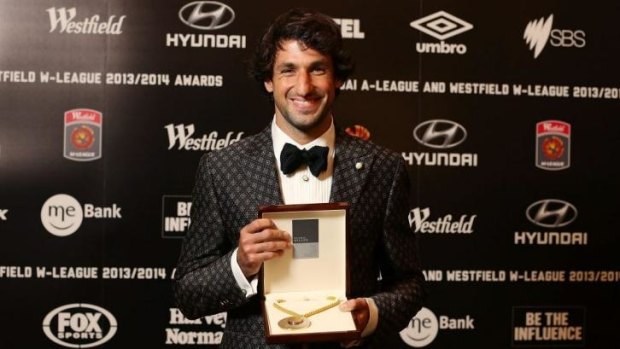 Thomas Broich of the Brisbane Roar poses with the Johnny Warren Medal at Royal Randwick Racecourse on Monday night.