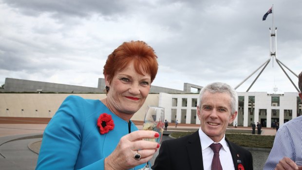 Senator Pauline Hanson with Senator Malcolm Roberts at Parliament House.