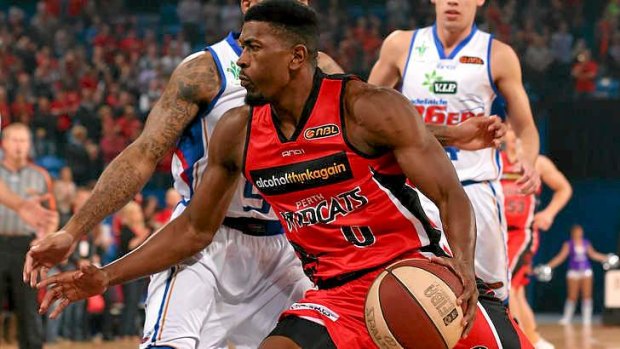 Jermaine Beal of the Wildcats drives to the basket against the Adelaide 36ers.