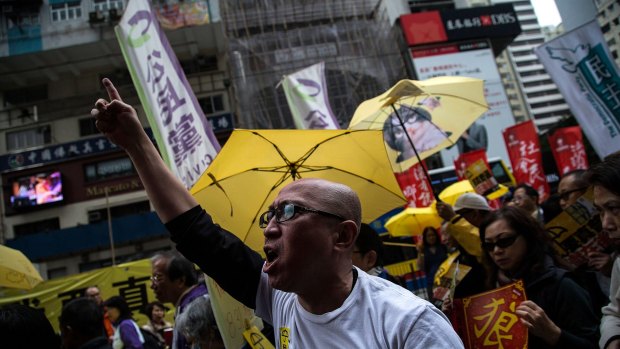 Protesters march through the centre of Hong Kong on Sunday.
