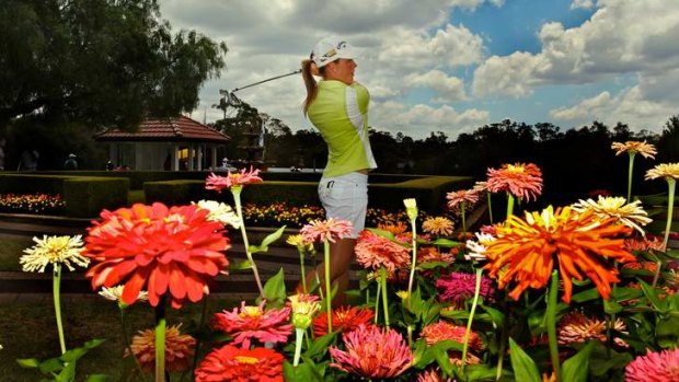 In bloom ... Stacey Keating on the practice range at Oatlands. The Victorian was tied for the lead in the NSW NSW Womens Open after a first-round 66 yesterday.