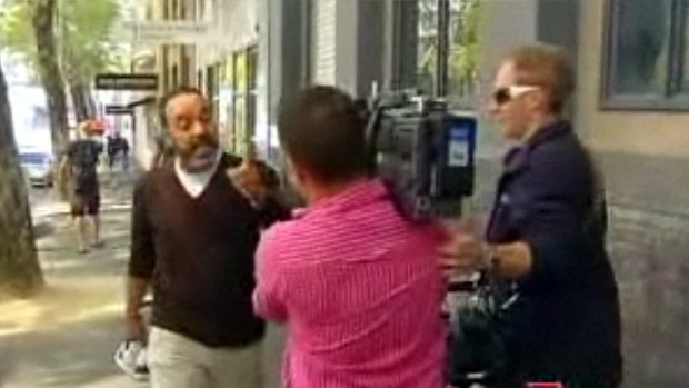 Gad Amr confronts a news crew outside a Melbourne court in a screen grab from the ABC's <i>Media Watch</i> program.