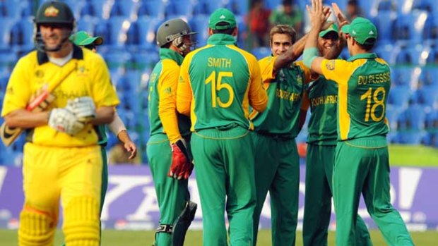 Imraan Tahir of South Africa celebrates the wicket of David Hussey of Australia.