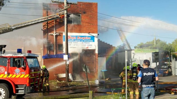 Firefighters battle a blaze in a Niddrie bargain shop.