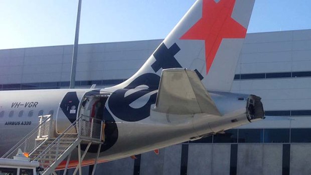The damaged rear of the Jetstar plane following a collision at Melbourne Airport.