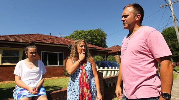 Worried about the future: Emma Pafumi, Michell Coomber and Dean Pafumi outside their house at Ada Street, Concord, which will be next to a motorway ramp.