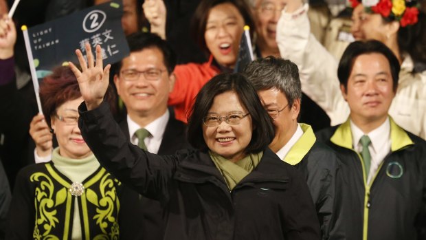 Tsai Ing-wen raises her hands as she declares victory in the island's presidential election.