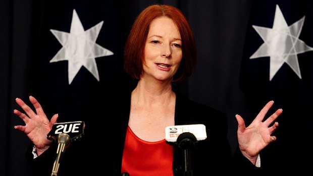 Julia Gillard talks to the media after returning from Washington.