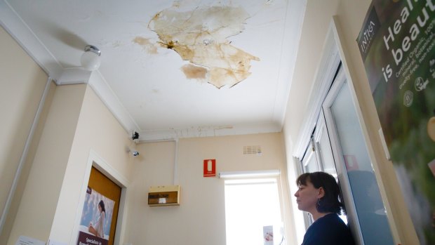 Emma Hely is frustrated by a leaky roof at her business in Ainslie. The building's heritage listing has prevented the building owner from making the repairs neccesary to fix the problem once and for all. Photo: Sitthixay Ditthavong