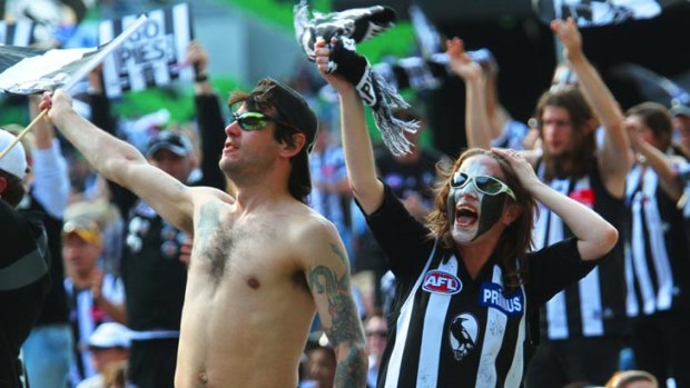 Collingwood fans celebrate another victory.